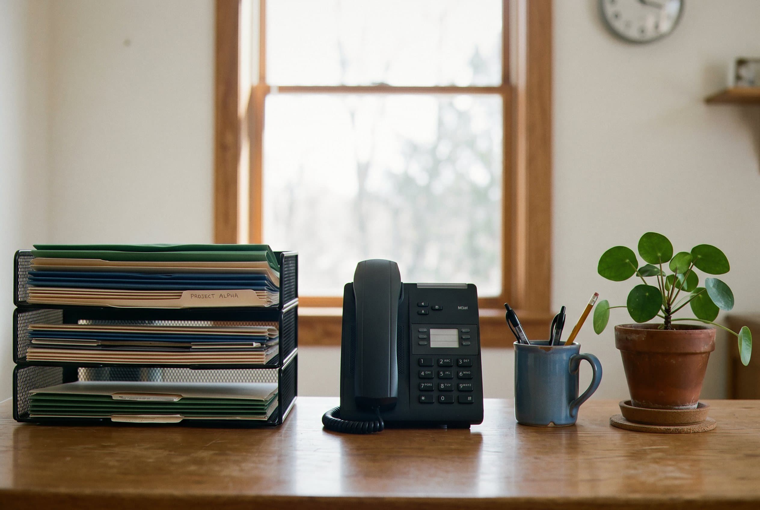 Desk organized with message routing system.